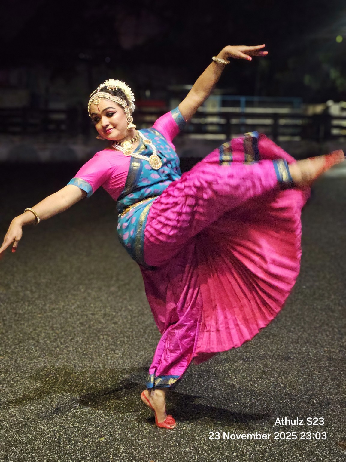 Dr. Devi Manjula in a dynamic dance movement